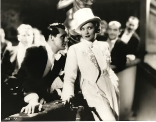 Marlene Dietrich in tux and tails with Cary Grant in 1932's Blonde Venus