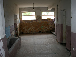 This is the ground floor entrance hall with the first door we will go through far left