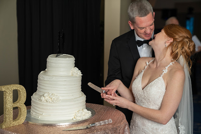 Bride and Groom cake cutting Port Saint Lucie Civic Center Wedding Photos by Stuart Wedding Photographer Heather Houghton Photography