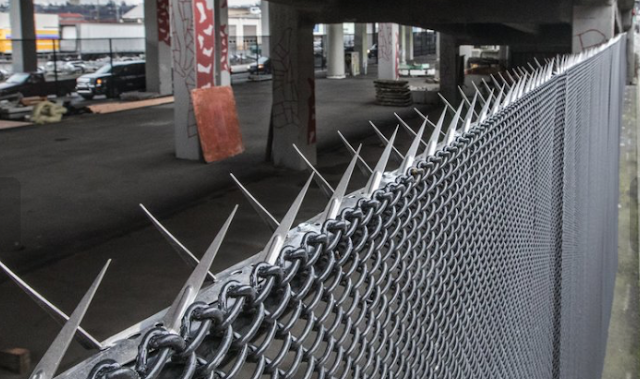 Seattle is putting fences under its bridges to keep campers out — and some say that’s wrong 