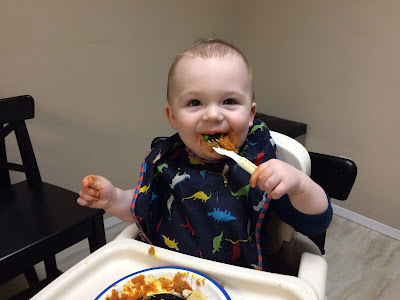 Baby Eating Squash and Meatballs