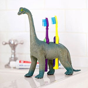 Dinosaur toothbrush holder with toothbrushes