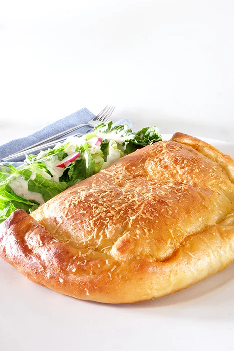 baked calzone on a plate