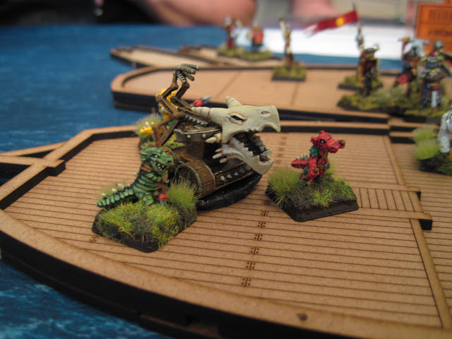 The objective, the third bolt thrower held by Karl's leezards.