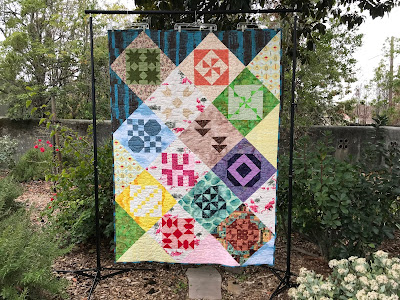 Sampler quilt with faux on-point setting