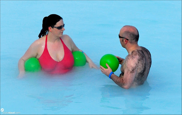 Man, woman and green balls in Blue Lagoon, Iceland