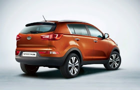 Rear 3/4 view of orange 2011 Kia Sportage