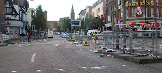 Litter-strewn Shaftsbury Square after the main morning parade