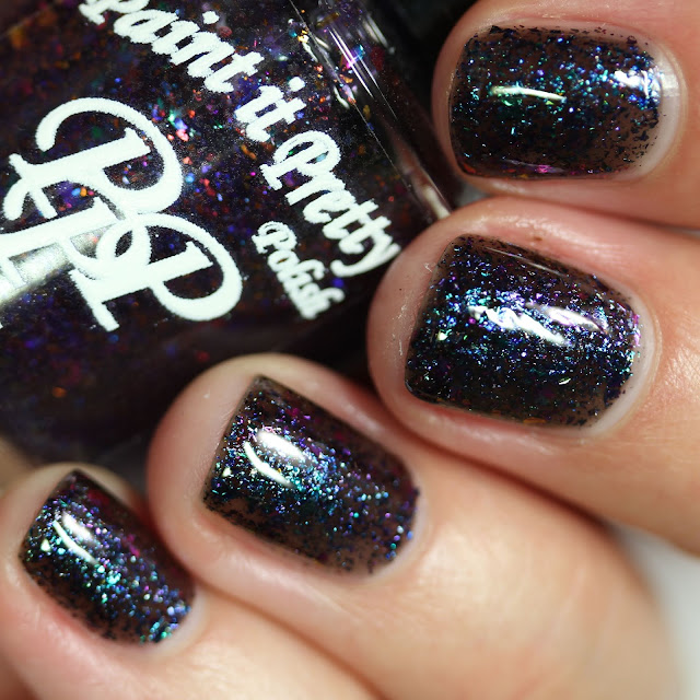 black nail polish with multi chrome flakes