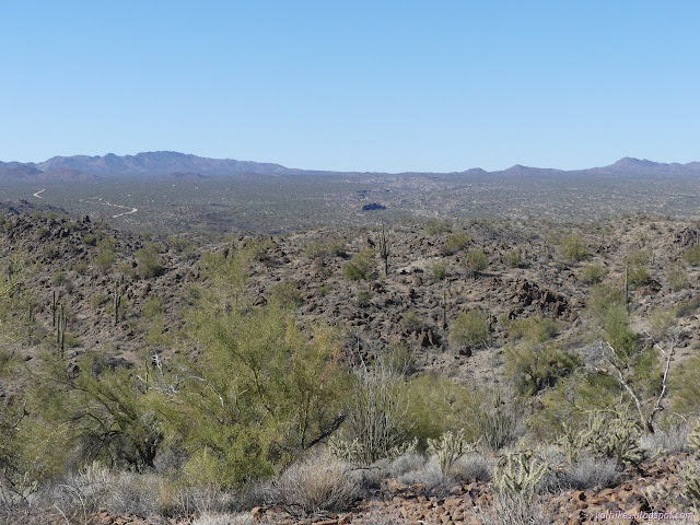 24: wide valley with a road