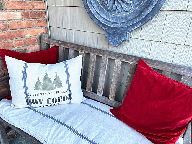 red velvet pillows and stenciled pillow with cushion cover