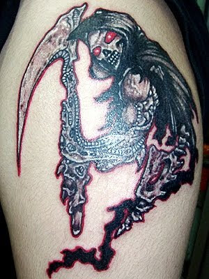 Tattoos Of Skulls And Guns. skull tattoos designs.