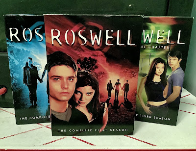 The DVD sets of Roswell, seasons 1, 2 and 3.