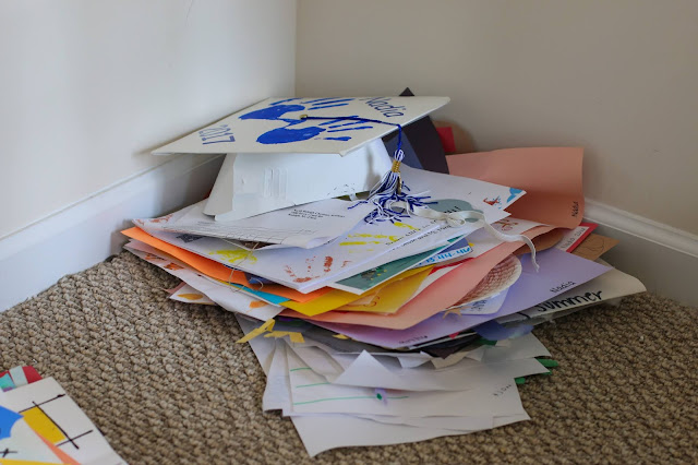 A pile of kid's artwork at the end of the school year