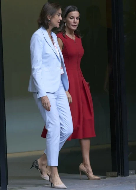 Queen Letizia wore a red fit-and-flare zip-front dress by Carolina Herrera. The Queen is wearing Jose Luis Joyerias gold earrings