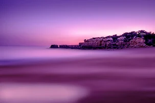 A long exposure after the sunset during a hot summer full moon in Faro Portugal captured By Al Cabri in 2022