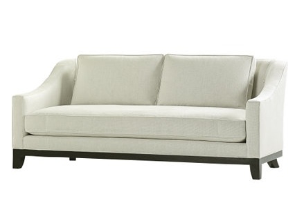 White sofa with exposed maple legs from Baker Furniture