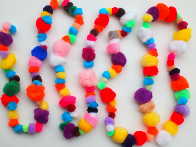 how to make a pom-pom garland- the absolute easiest craft with adorable results!  