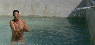 wincing at the cold spring water