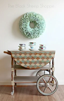 Vintage tea cart painted with a fun pattern.