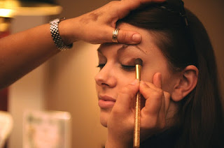 Woman getting eye makeup done.jpeg