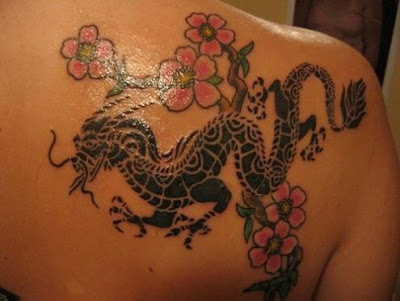 Dragon Tattoo Japanese black dragon and pink flowers tattoo on the back