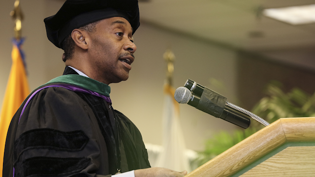 Dr. Jonathan Woodson delivers remarks at the investiture of the sixth president of USU, Dr. Richard Thomas. (Photo by Tom Balfour)
