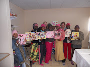 The teenage girls with their collages, Jen a volunteer, and I
