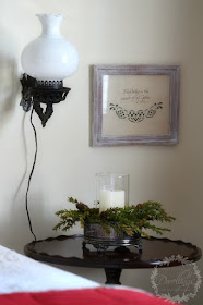 Silver dish and pine cone wreath turned candle holder for the guest room.