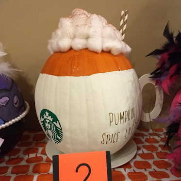 Photo of pumpkin decorated as Pumpkin Spice Latte