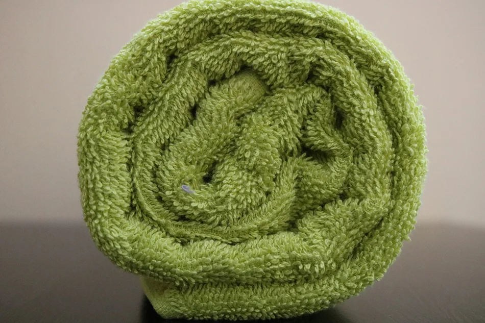 Rolled lime green towel