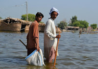 Devastating floods in Pakistan in 2010 killed hundreds of people and led to a severe outbreak of cholera. (Image Credit: Saleem Shaikh) Click to Enlarge.