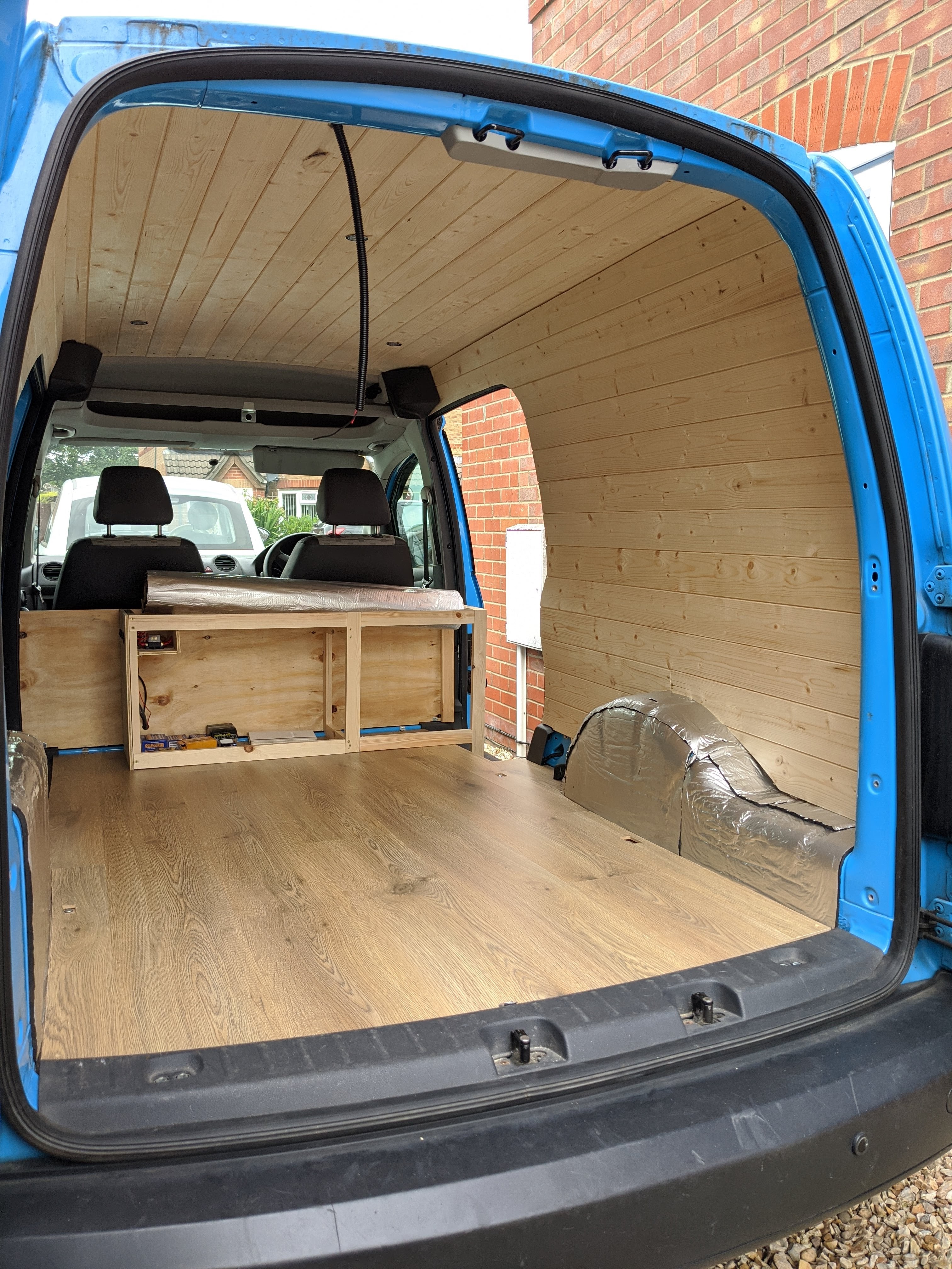 Wood panelled walls and ceiling VW van conversion