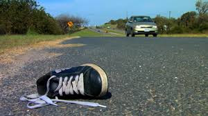 shoe on side of highway