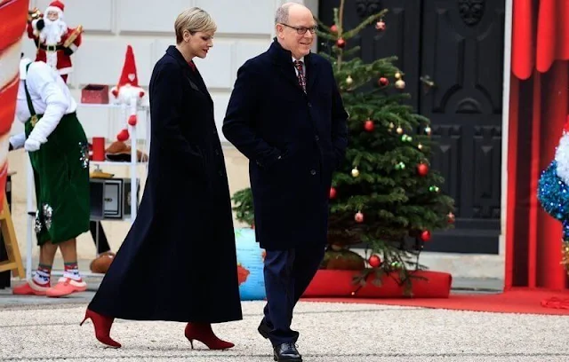 Princess Charlene is wearing the Emory jumper by Emilia Wickstead, and the Princess is wearing an Akris navy blue coat