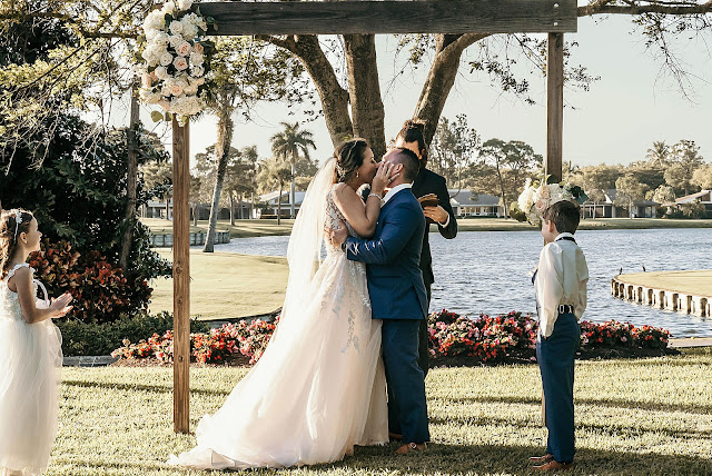 Just married Bride and Groom kissing at Ceremony