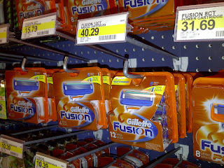 Store display of Gillette Fusion razor blades, one box is priced at over $40 for 12 razor blades