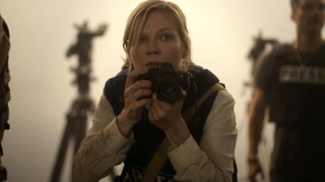 A woman with a camera in a foggy room