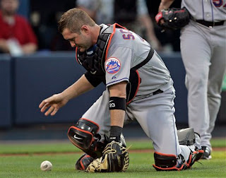 Brian Schneider's error helped the Braves get their first run.