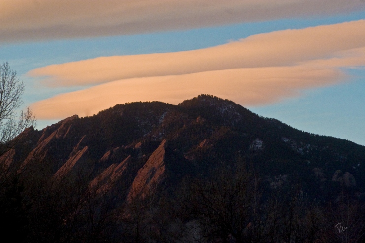 Lenticular clouds over the Flatirons at sunrise
