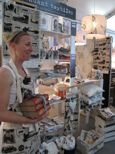  Nicola from Fondant Textiles holding a random pile of books while charming customers.  Photo by Keri Muller.