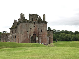 A photograph of the ruins of Caerlaverock Castle showing the front towers and entrance to the castle.  Photo by Kevin Nosferatu for the Skulferatu Project.