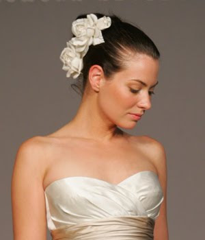 two flowers on updo wedding hairstyle