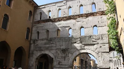Porta Borsari stone structure with holes, in Verona, Italy.