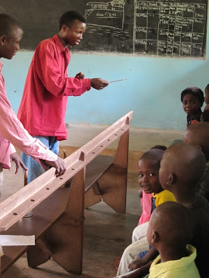 Sauve Ngwadi (right) and Paul Makoloto (left) the Sunday after the seminar ended, teaching some of the children at Lusekele.