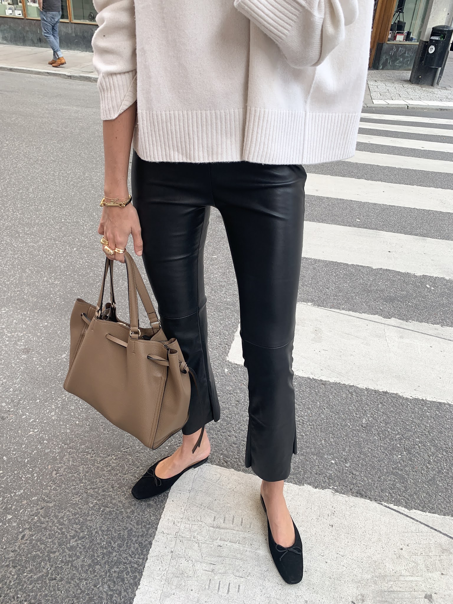Best Black Flats — Fall outfit idea with a cream sweatre, leather pants, and Manolo Blahnik mule flats