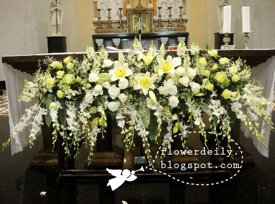 A closer look at the flower arrangements in front of the main altar