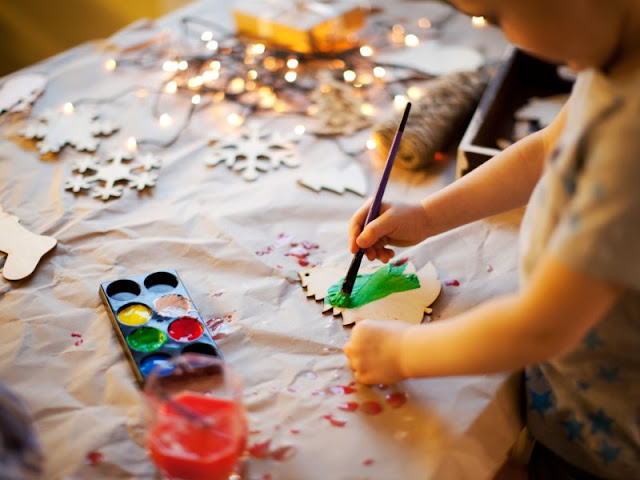 A child making holiday decorations