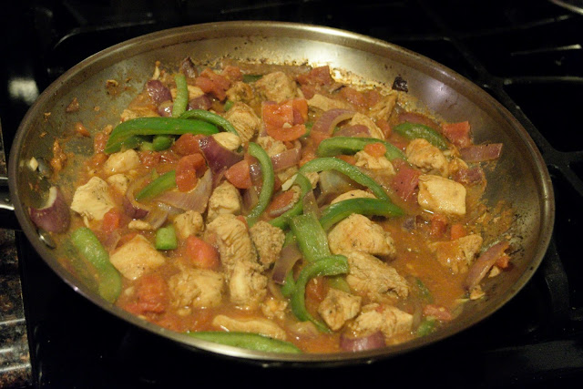 The chicken fajita pasta simmering in a skillet. 