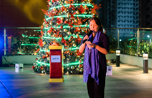 Ms. Carmeli Bantug-Zayco delivers a Christmas message in behalf of Mayor Albee Benitez.